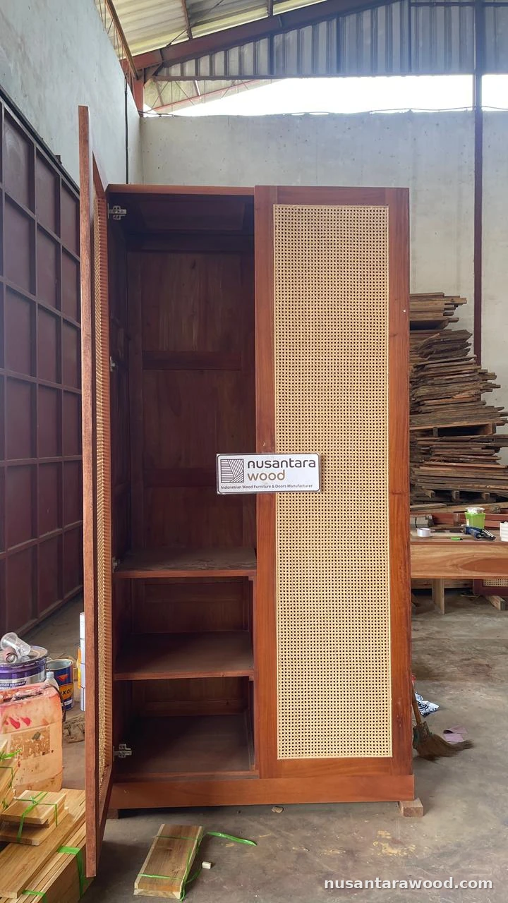 Mahogany Wardrobe with Rattan Cane Door Solid mahogany wardrobe with a rattan cane door panel and open shelving made by Nusantara Wood